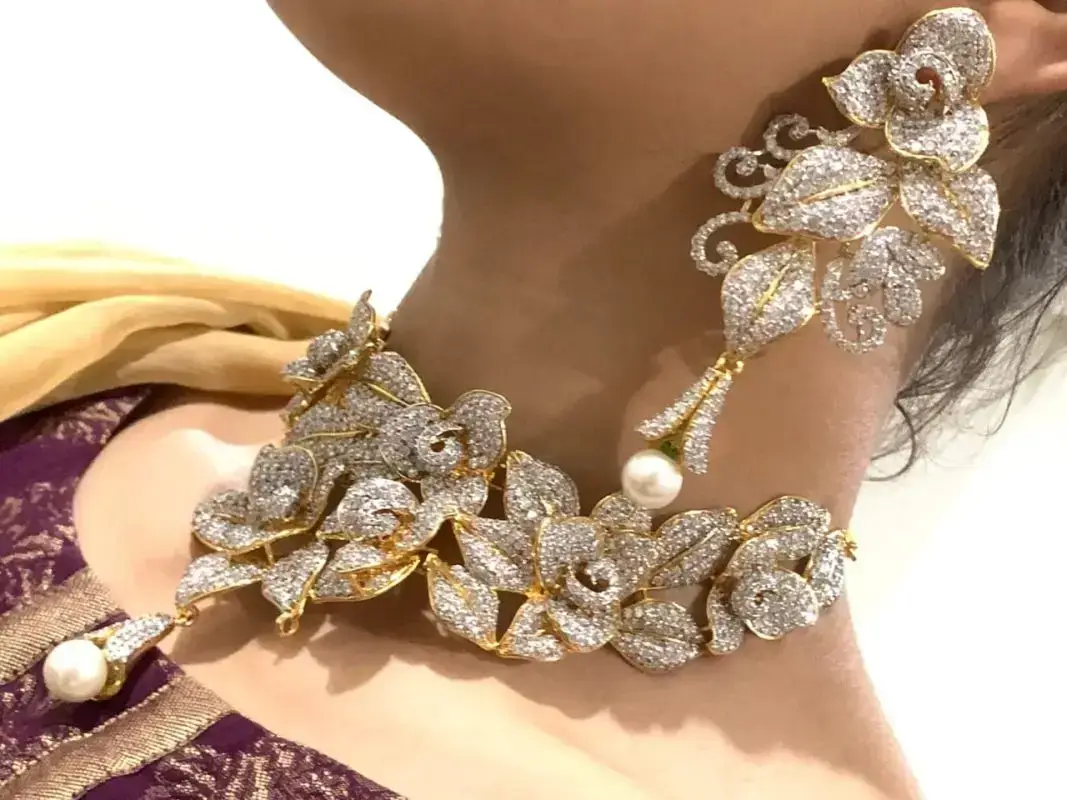 Floral stone choker set with matching earrings in gold and silver finish &ndash; Zuha Jewellery karachi