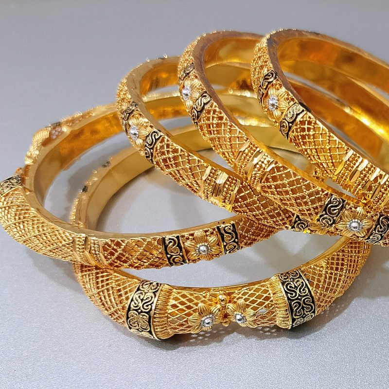 Close-up detailing of gold plated bangles &ndash; Karachi jewellery design