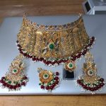 Silver 925 bridal jewellery set by Zuha Jewellery Karachi—includes gold-plated choker, earrings, ring, and maang tikka with emerald, ruby, and pearl accents. Best for brides in Karachi.