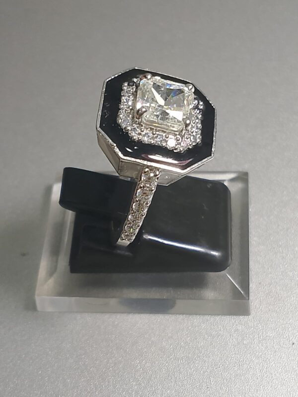 an Art Deco style octagonal black onyx and diamond cocktail ring