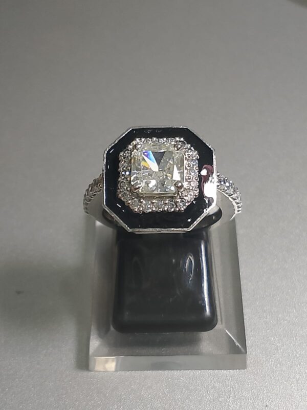 an Art Deco style octagonal black onyx and diamond cocktail ring. 2