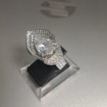 Pear-cut Diamond Engagement Ring With A Double Halo Setting And A Pavé Band