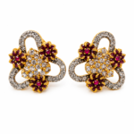 Antique gold plated maroon floral trinity pendant set with matching earrings and CZ stones Antique gold plated maroon floral trinity pendant set with matching earrings and CZ stones